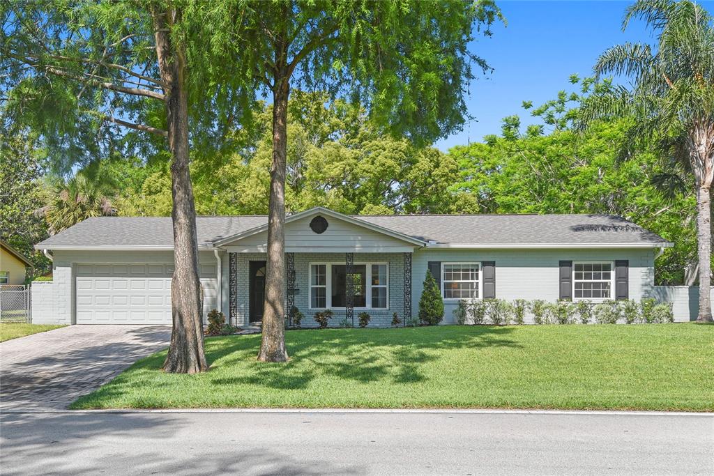 1291 Oxford Road Maitland, FL 32751 - Photo 1 of 1 a front view of a house with a garden