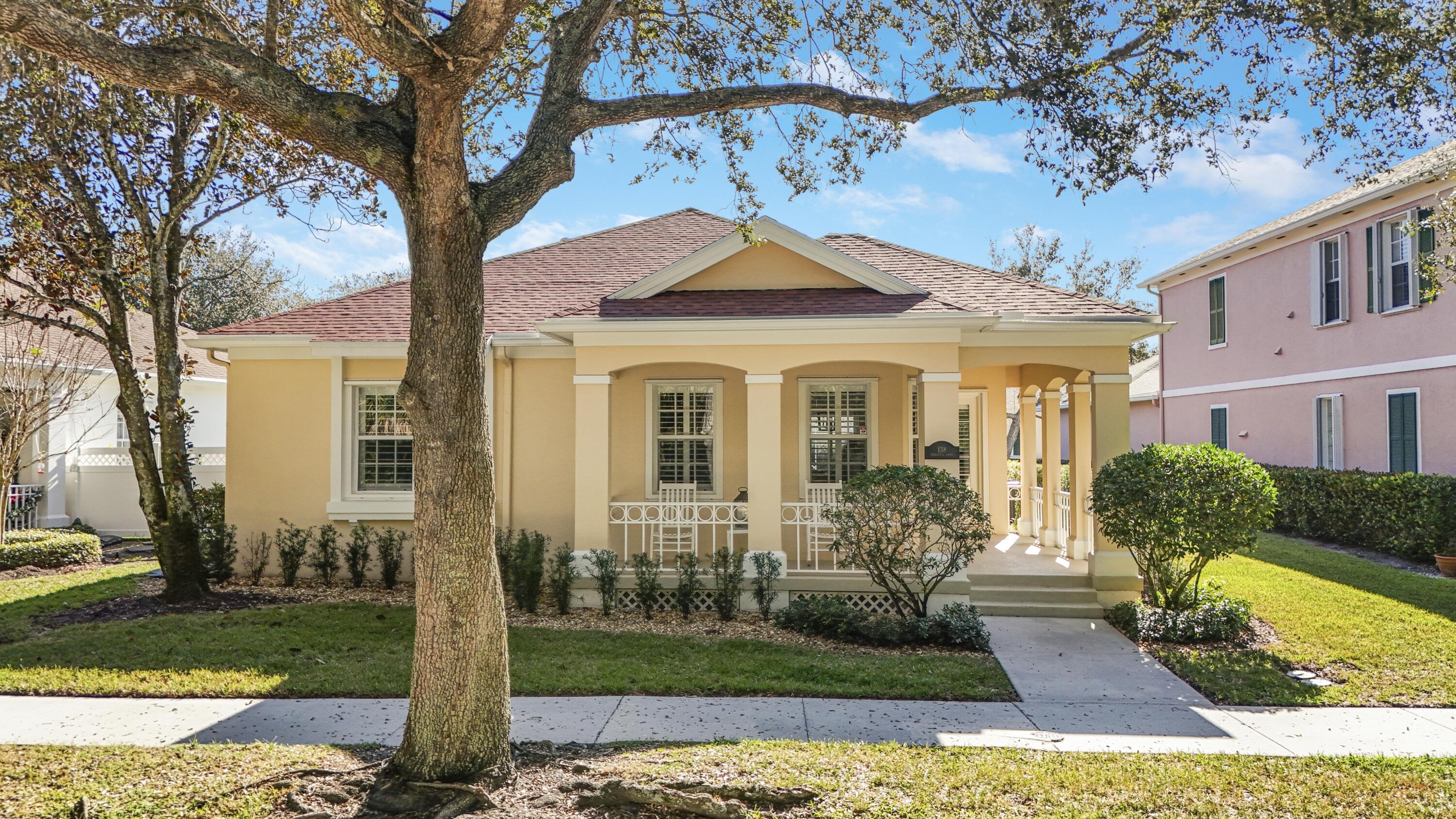 a front view of a house with garden