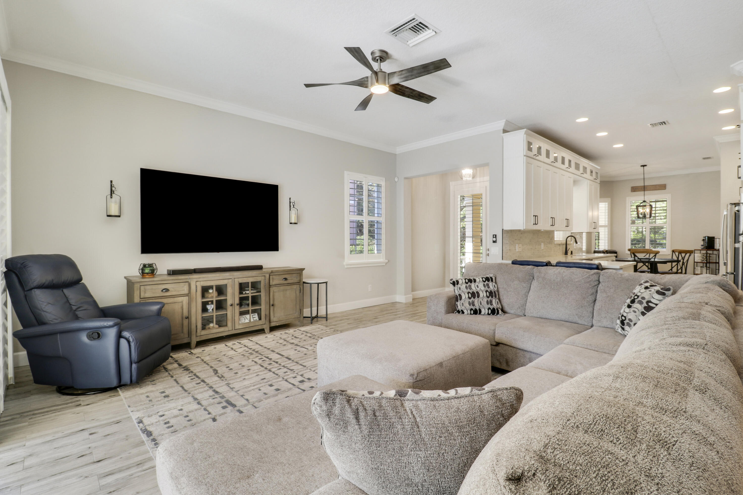 138 Newcastle Drive Jupiter, FL 33458 - Photo 12 of 44 a living room with furniture and a flat screen tv