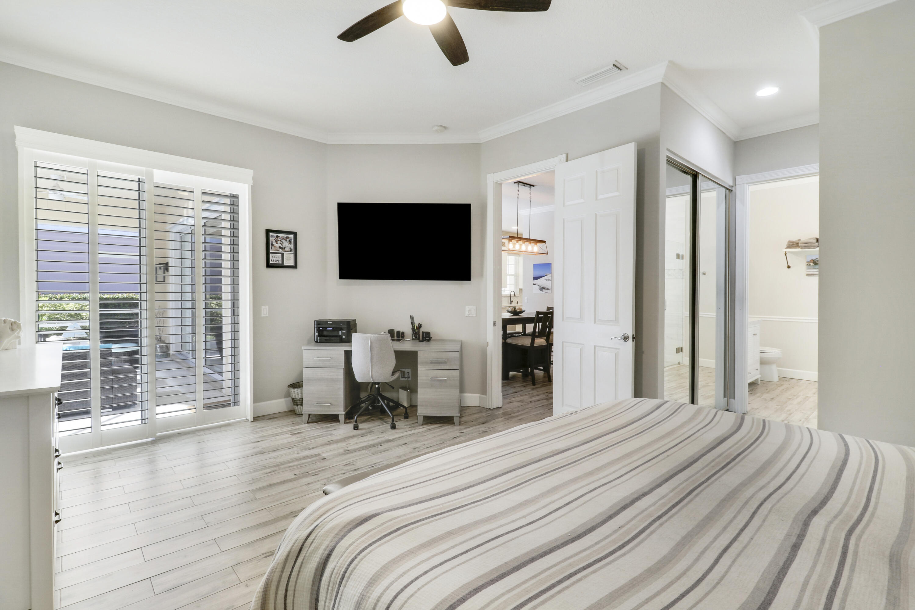 138 Newcastle Drive Jupiter, FL 33458 - Photo 20 of 44 a bedroom with furniture and a flat screen tv