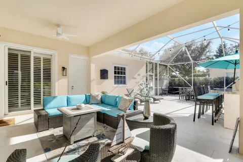 a outdoor space with patio the couches and a dining table with the view of the back