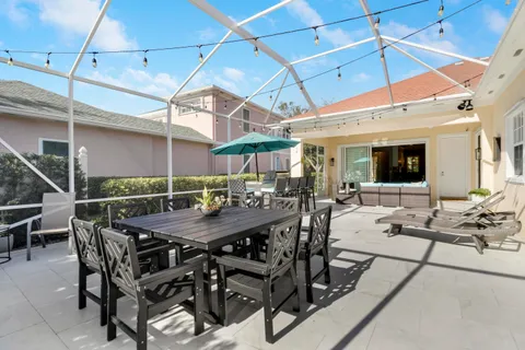 a view of a dinning table and chairs in the patio