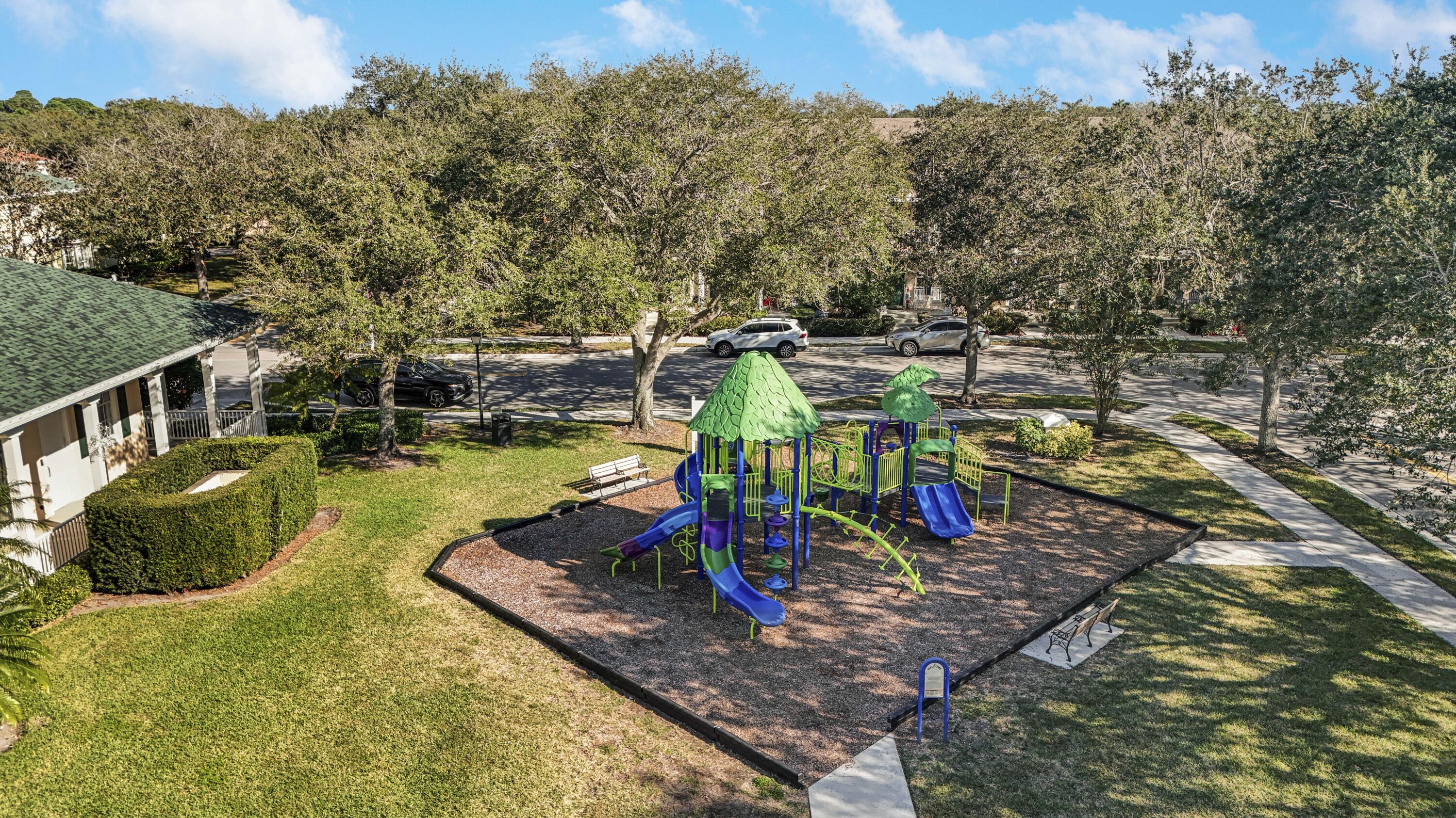 138 Newcastle Drive Jupiter, FL 33458 - Photo 37 of 44 a view of a lake with a house