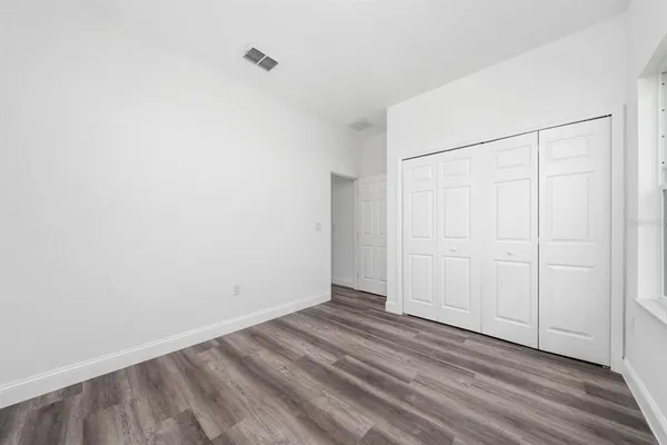 a view of an empty room and window
