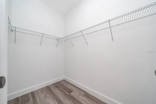a spacious bathroom with double sink and a mirror