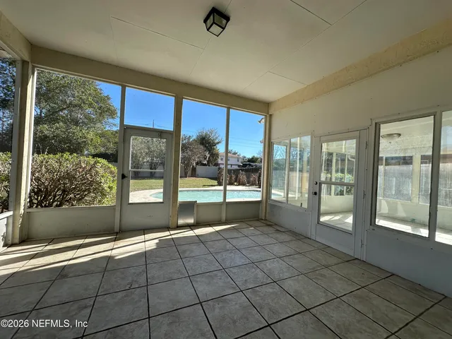 a view of an empty room and window