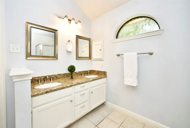 a view of a house with garden and a trees