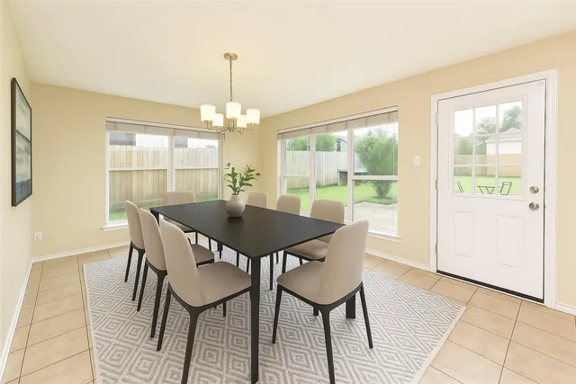 a view of a dining room with furniture window and outside view