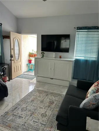 a living room with a flat screen tv and a couch