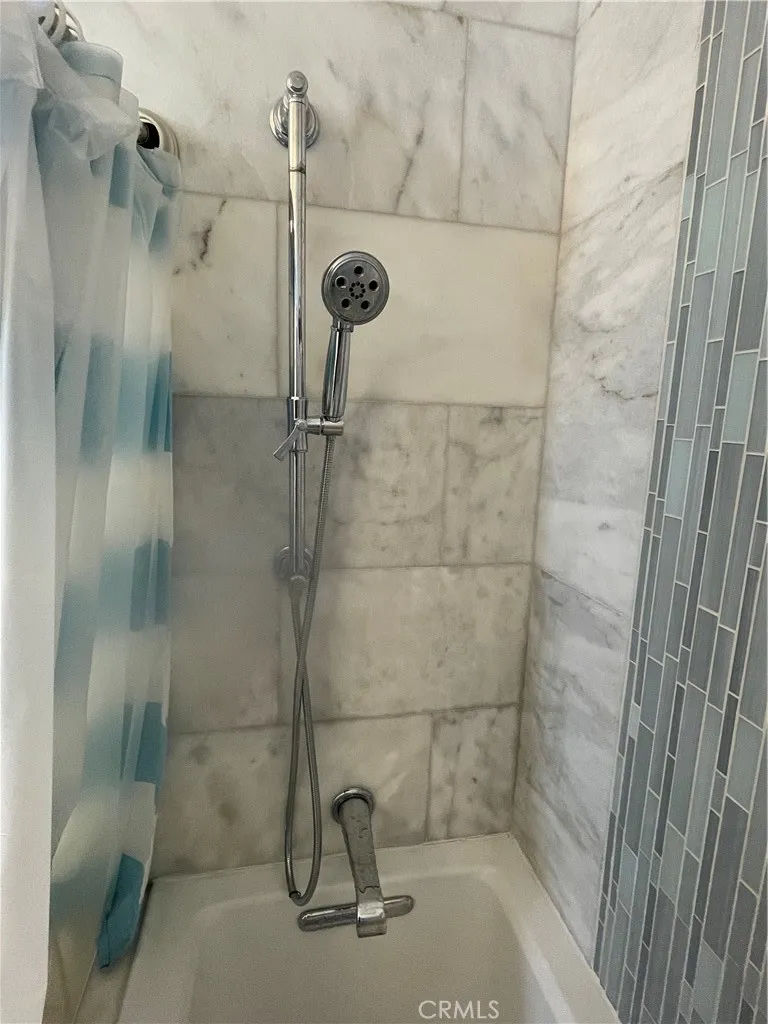 222 9th Street Huntington Beach, CA 92648 - Photo 4 of 13 a bathroom with a shower