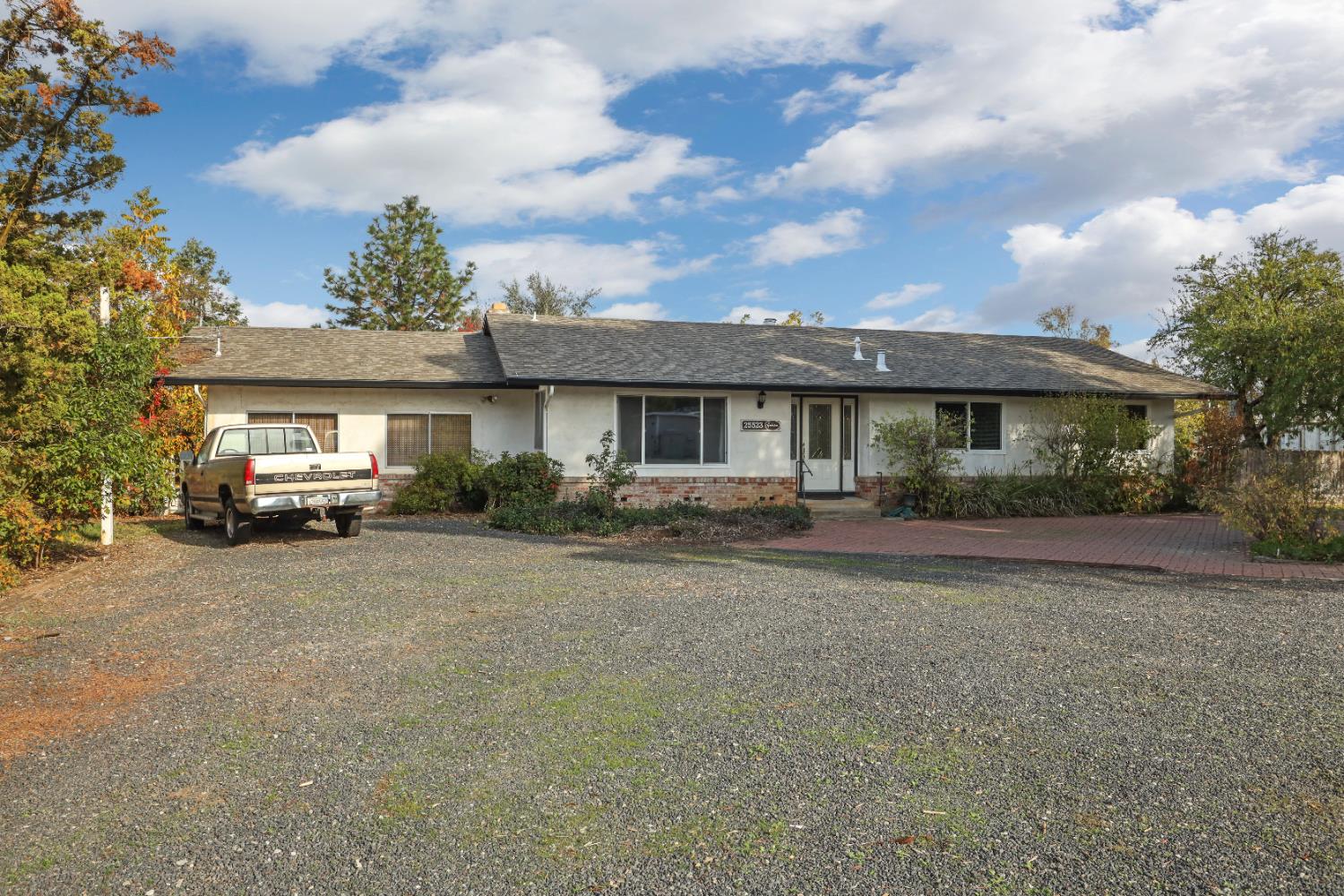 25523 East Groves Road Farmington, CA 95230 - Photo 13 of 65 a view of a house with a patio