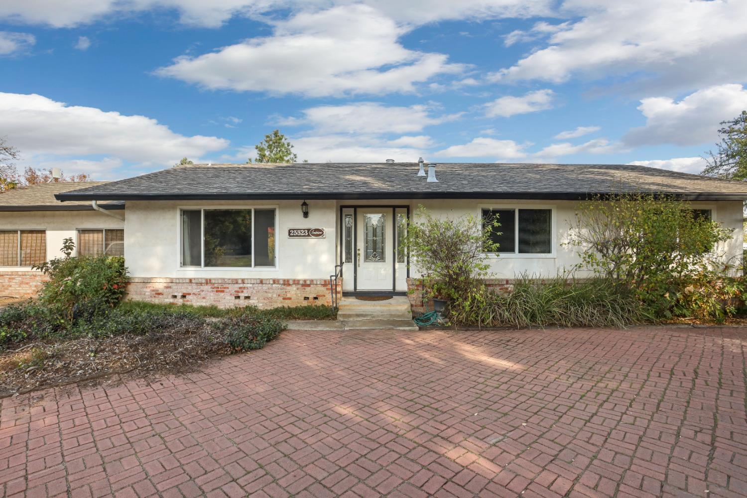 25523 East Groves Road Farmington, CA 95230 - Photo 17 of 65 a view of a house with a yard