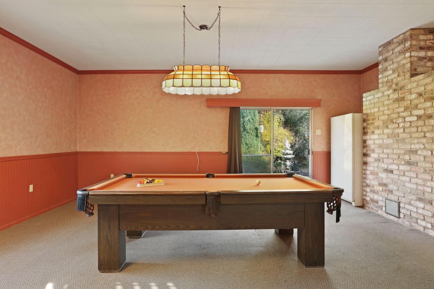25523 East Groves Road Farmington, CA 95230 - Photo 39 of 65 a room with pool table and windows