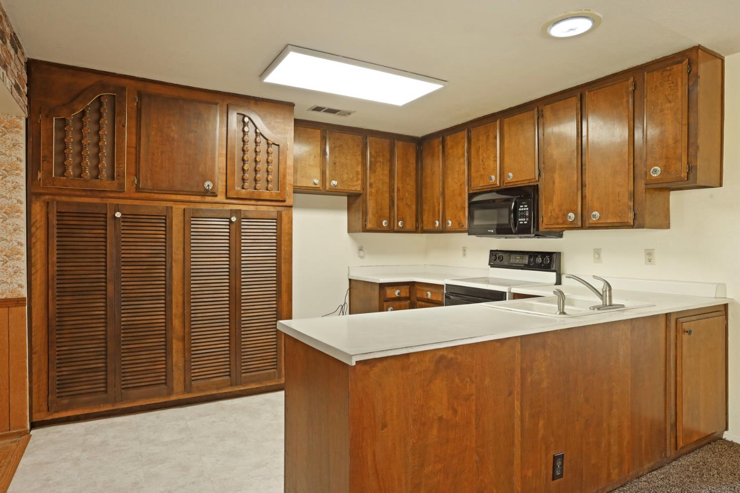 25523 East Groves Road Farmington, CA 95230 - Photo 41 of 65 a kitchen with granite countertop stainless steel appliances a refrigerator and a sink
