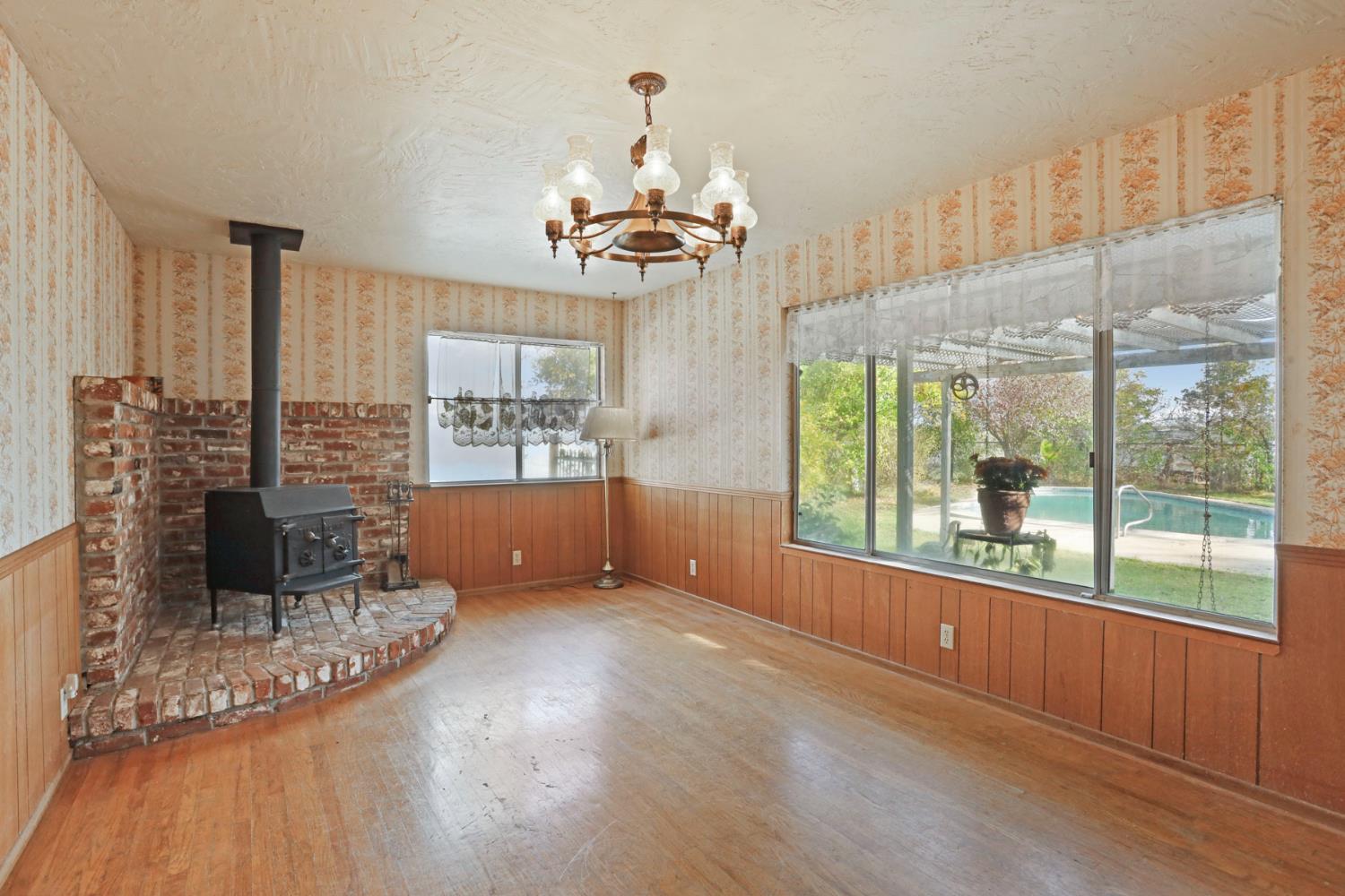 25523 East Groves Road Farmington, CA 95230 - Photo 48 of 65 a view of a livingroom with furniture window and wooden floor