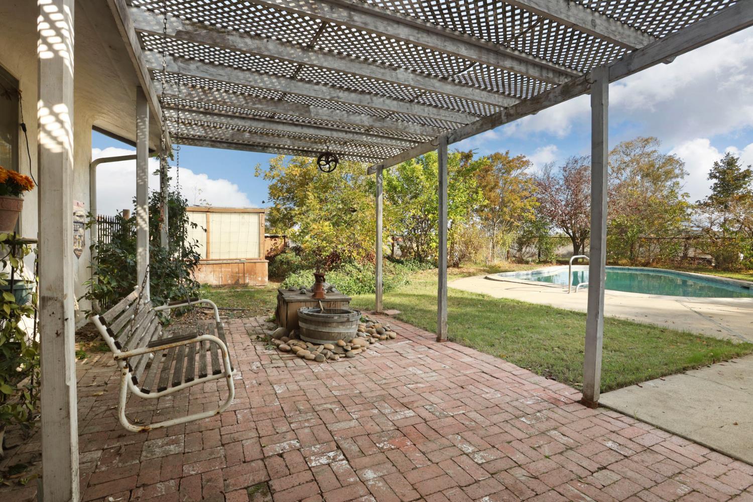 25523 East Groves Road Farmington, CA 95230 - Photo 50 of 65 a view of a porch with wooden floor