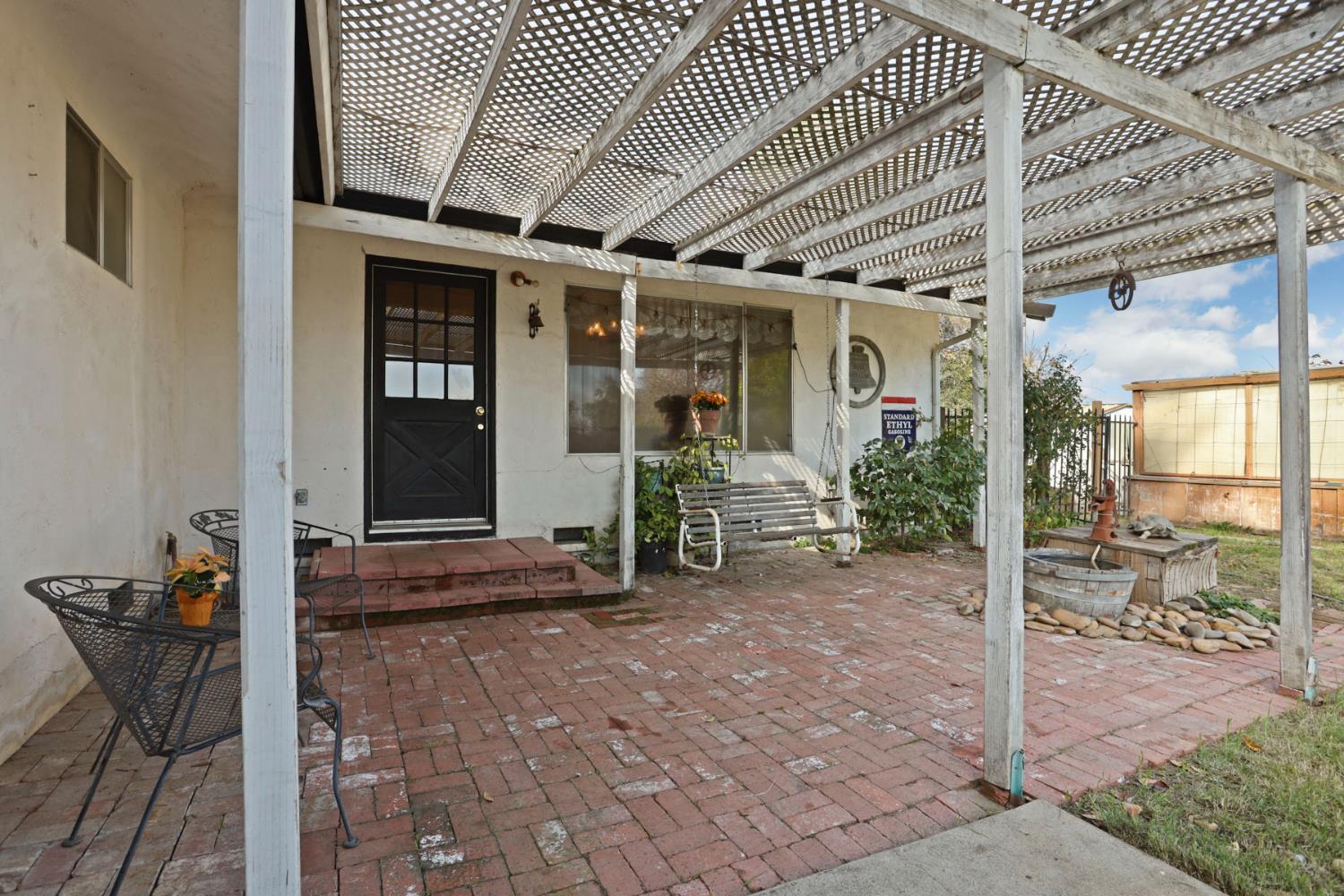 25523 East Groves Road Farmington, CA 95230 - Photo 51 of 65 a view of a porch with furniture