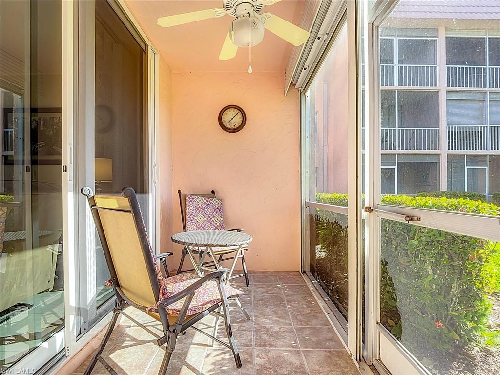 175 Turtle Lake Court, Unit 108 Naples, FL 34105 - Photo 16 of 17 Sunroom featuring a ceiling fan