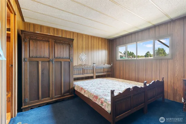 a bedroom with a bed and window