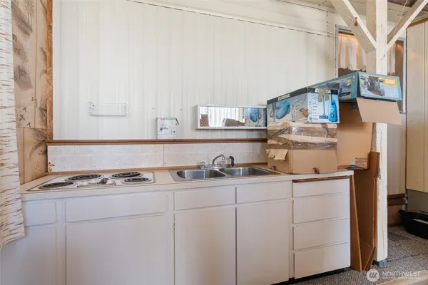 a kitchen with stainless steel appliances granite countertop a sink and cabinets