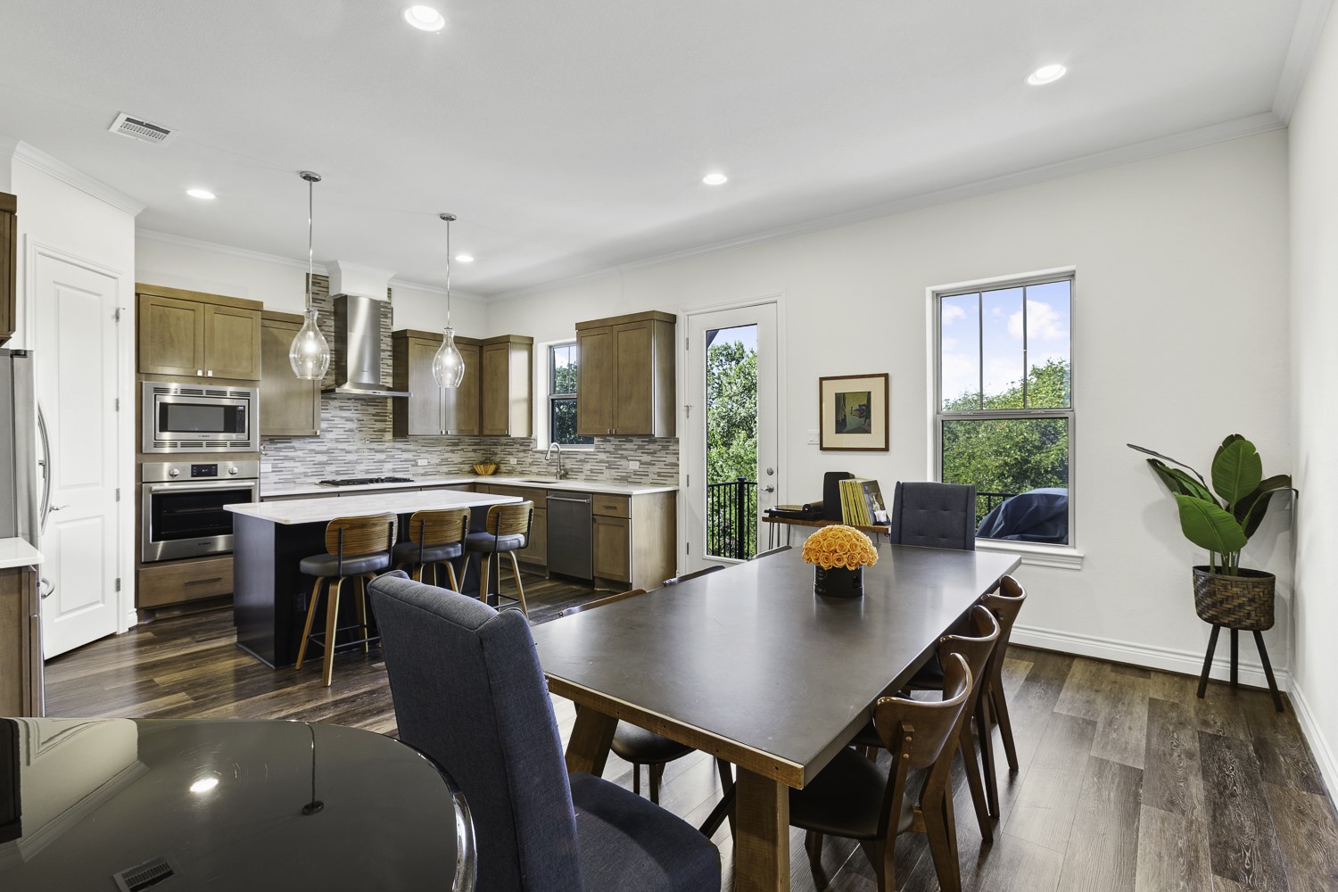a kitchen with a table and chairs in it