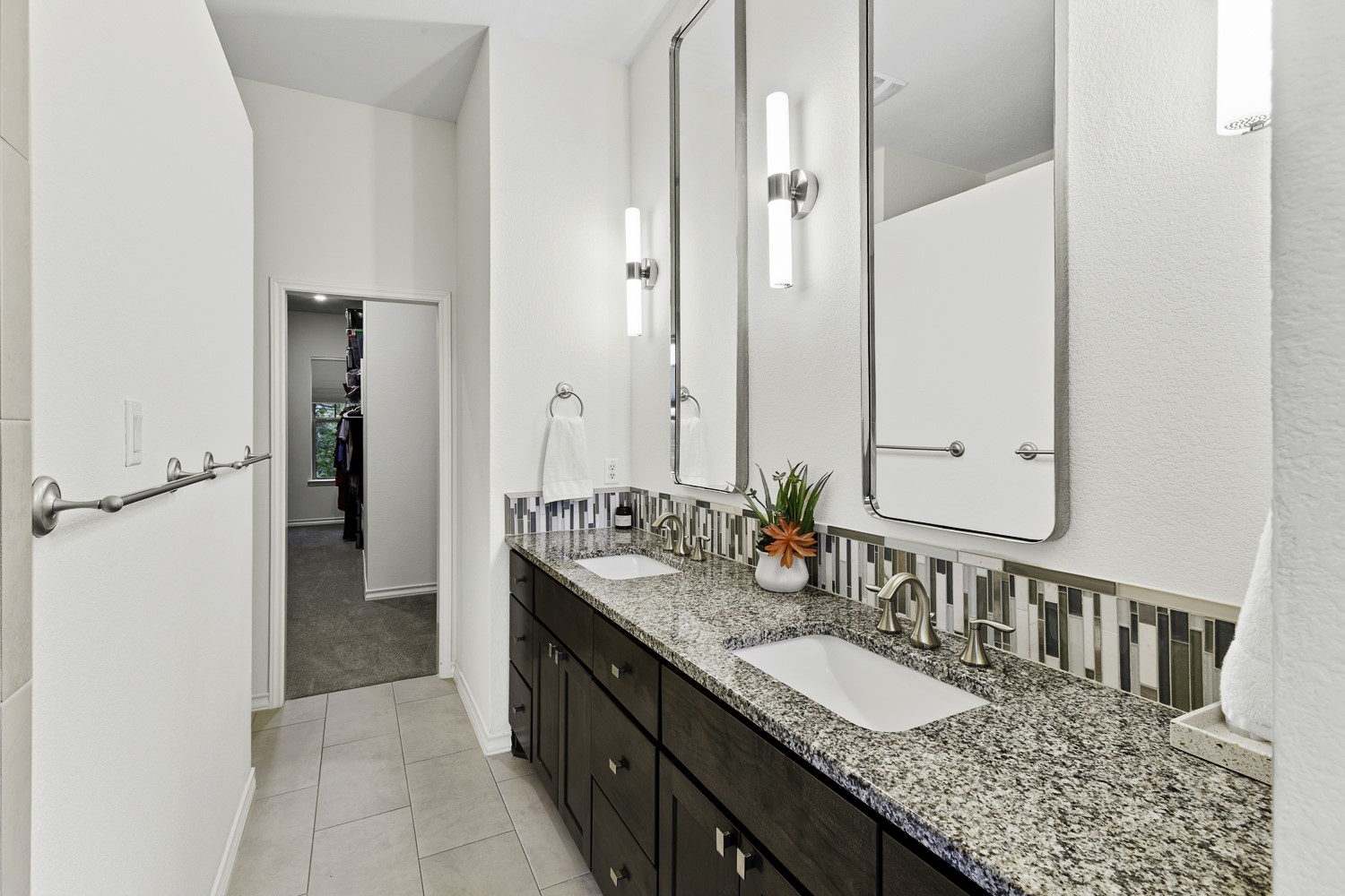 221 Adams Street Georgetown, TX 78628 - Photo 15 of 35 a bathroom with a granite countertop double vanity sink and a mirror