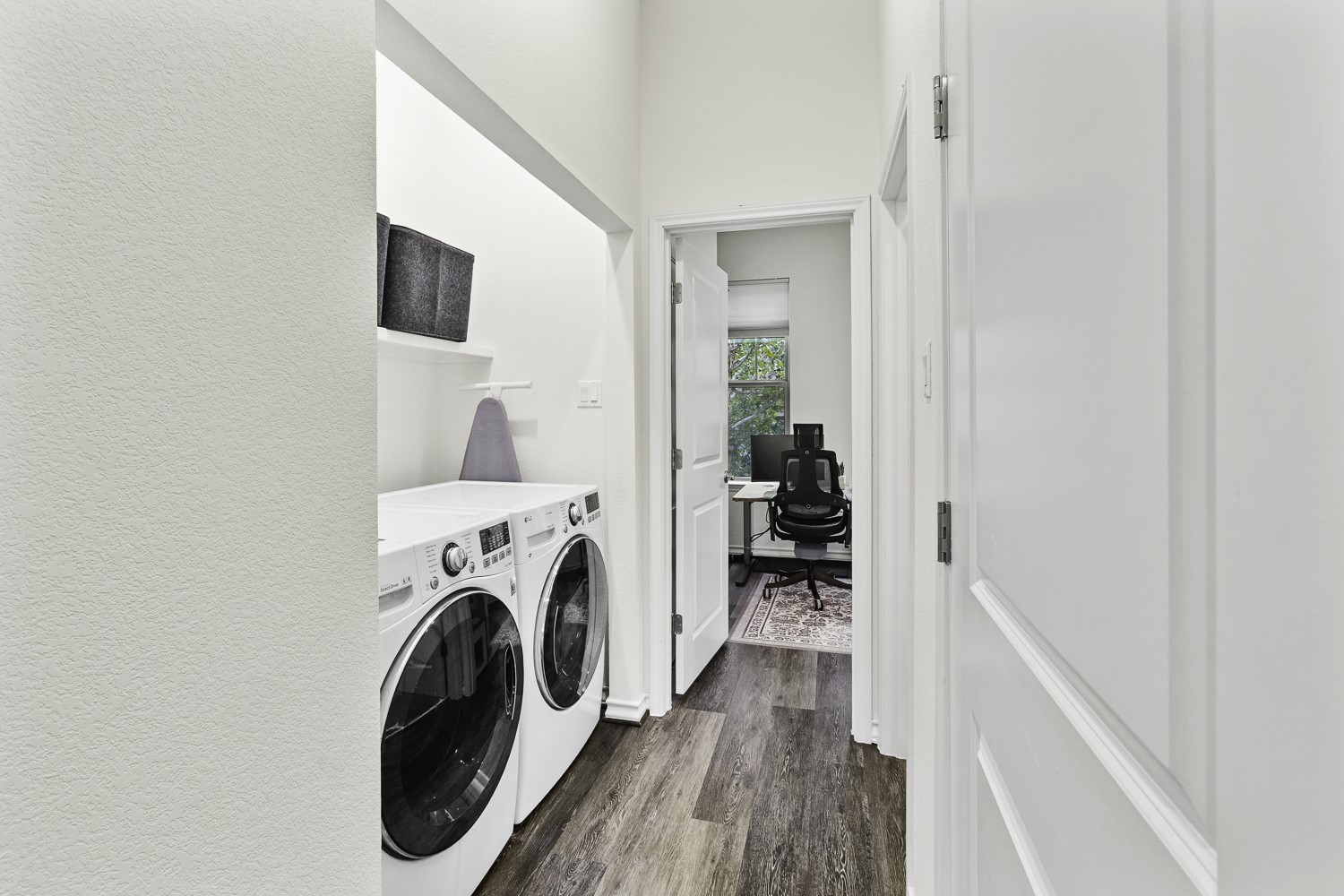 221 Adams Street Georgetown, TX 78628 - Photo 21 of 35 a view of a hallway with washer and dryer