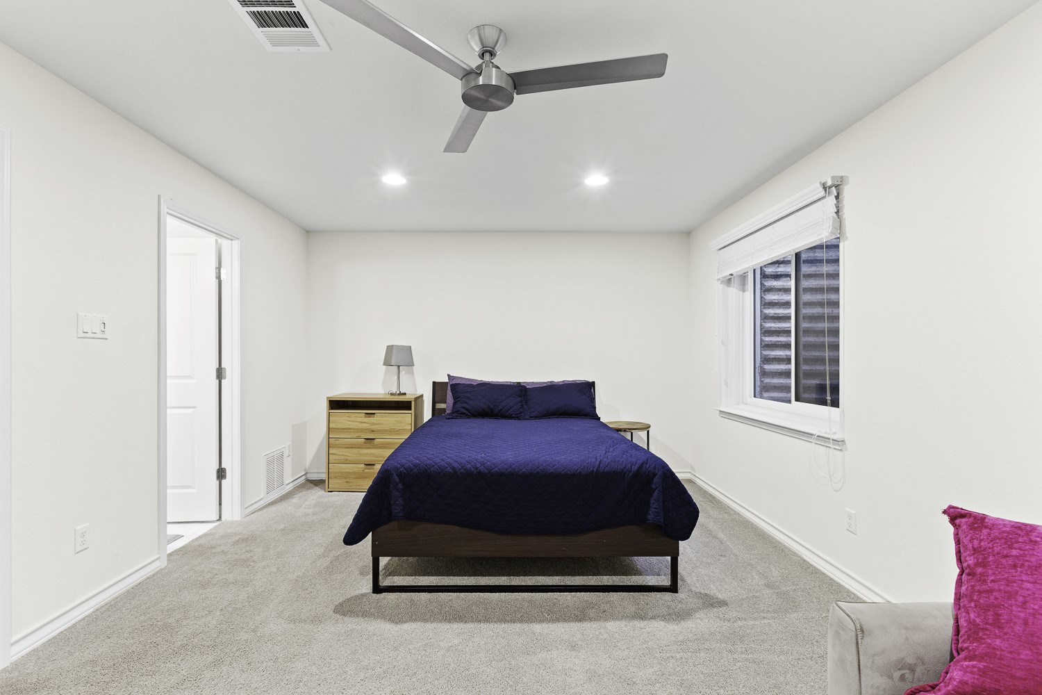 221 Adams Street Georgetown, TX 78628 - Photo 24 of 35 a bedroom with a bed and window