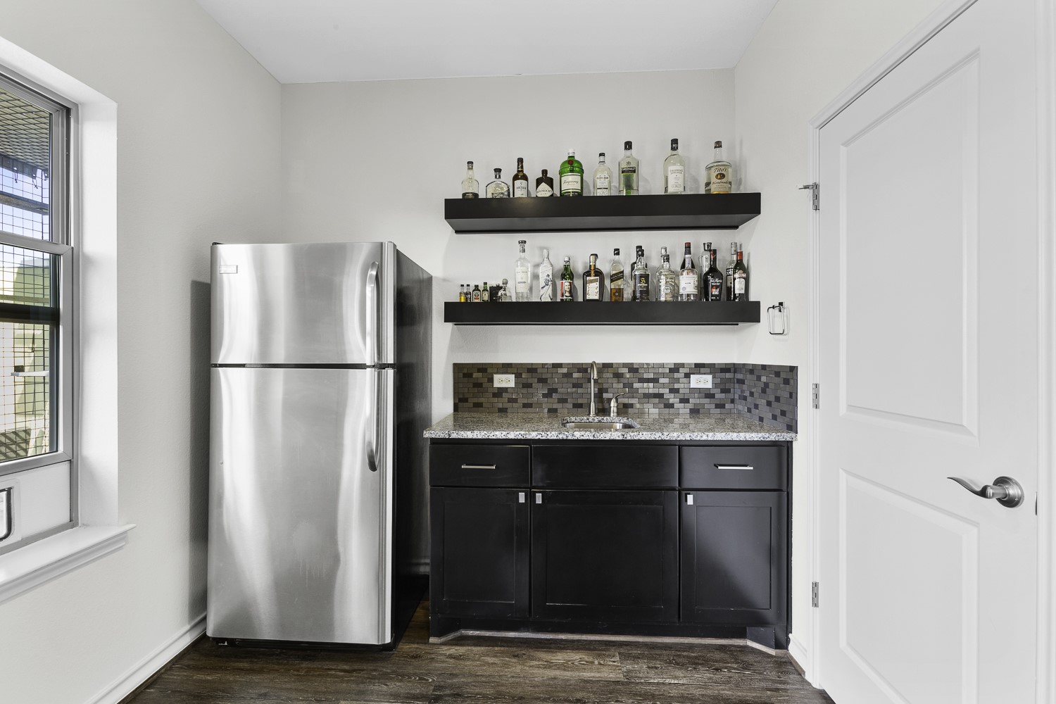 221 Adams Street Georgetown, TX 78628 - Photo 27 of 35 a kitchen with a refrigerator and a stove