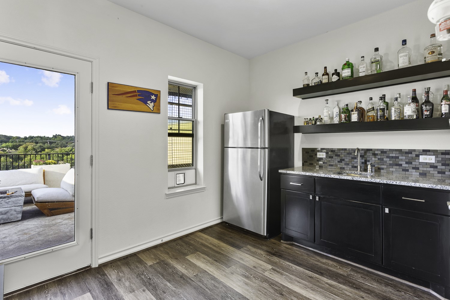 221 Adams Street Georgetown, TX 78628 - Photo 28 of 35 a kitchen with stainless steel appliances granite countertop a refrigerator and a stove