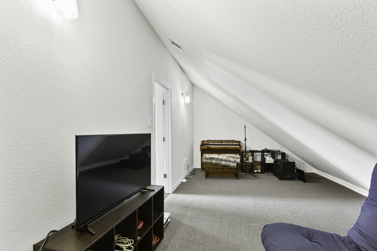 221 Adams Street Georgetown, TX 78628 - Photo 29 of 35 a living room with furniture and a flat screen tv