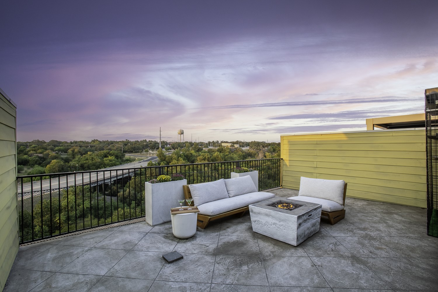221 Adams Street Georgetown, TX 78628 - Photo 33 of 35 a roof deck with couches and potted plants