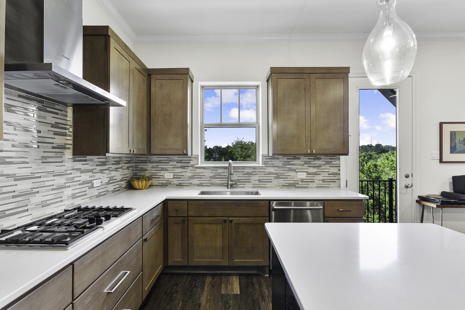 221 Adams Street Georgetown, TX 78628 - Photo 8 of 35 a kitchen with a sink stove and cabinets