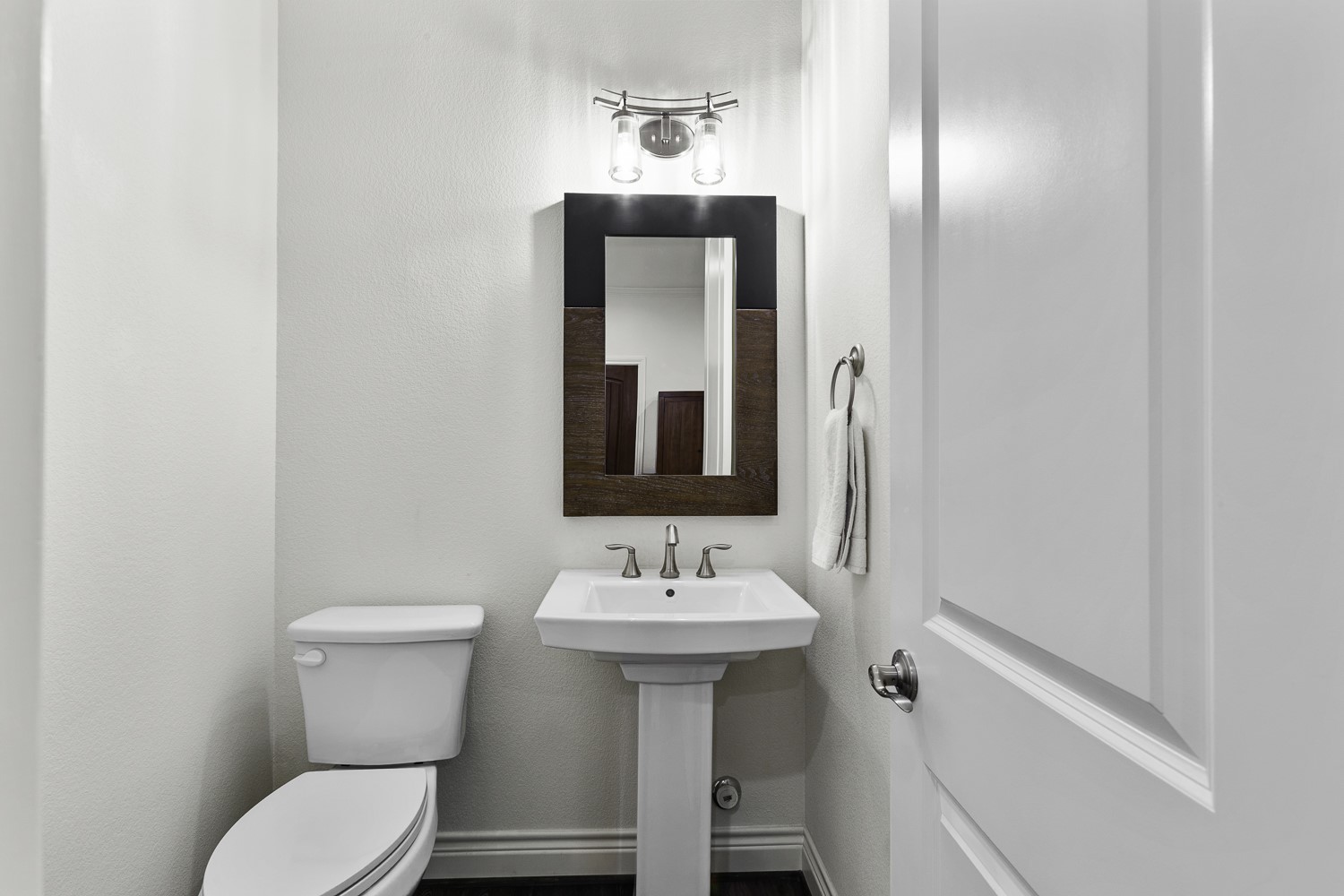 221 Adams Street Georgetown, TX 78628 - Photo 10 of 35 a bathroom with a toilet sink and mirror
