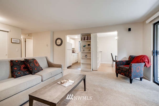 13801 Old Redmond Road, Unit A101 Redmond, WA 98052 - Photo 2 of 25 a living room with furniture and a window
