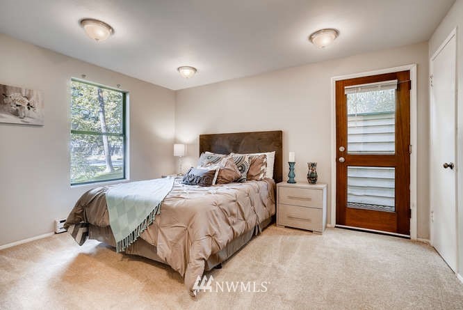 13801 Old Redmond Road, Unit A101 Redmond, WA 98052 - Photo 11 of 25 a bedroom with a bed and a window