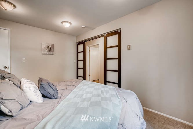 13801 Old Redmond Road, Unit A101 Redmond, WA 98052 - Photo 12 of 25 a bedroom with a large bed and a window