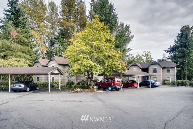 13801 Old Redmond Road, Unit A101 Redmond, WA 98052 - Photo 24 of 25 a car parked in front of a house