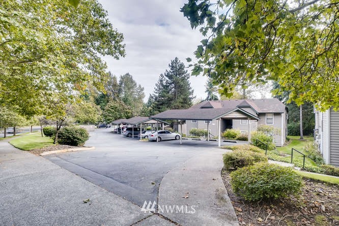 13801 Old Redmond Road, Unit A101 Redmond, WA 98052 - Photo 25 of 25 a view of a house with a yard and sitting area