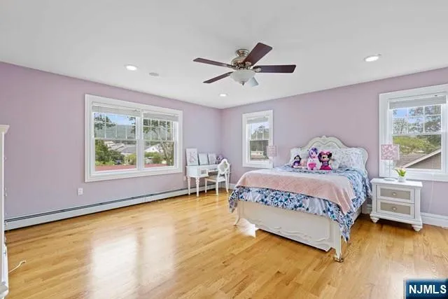 a spacious bedroom with a bed and a window