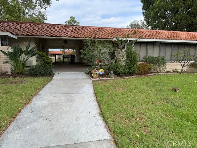a view of a patio with table and chairs potted plants with wooden fence