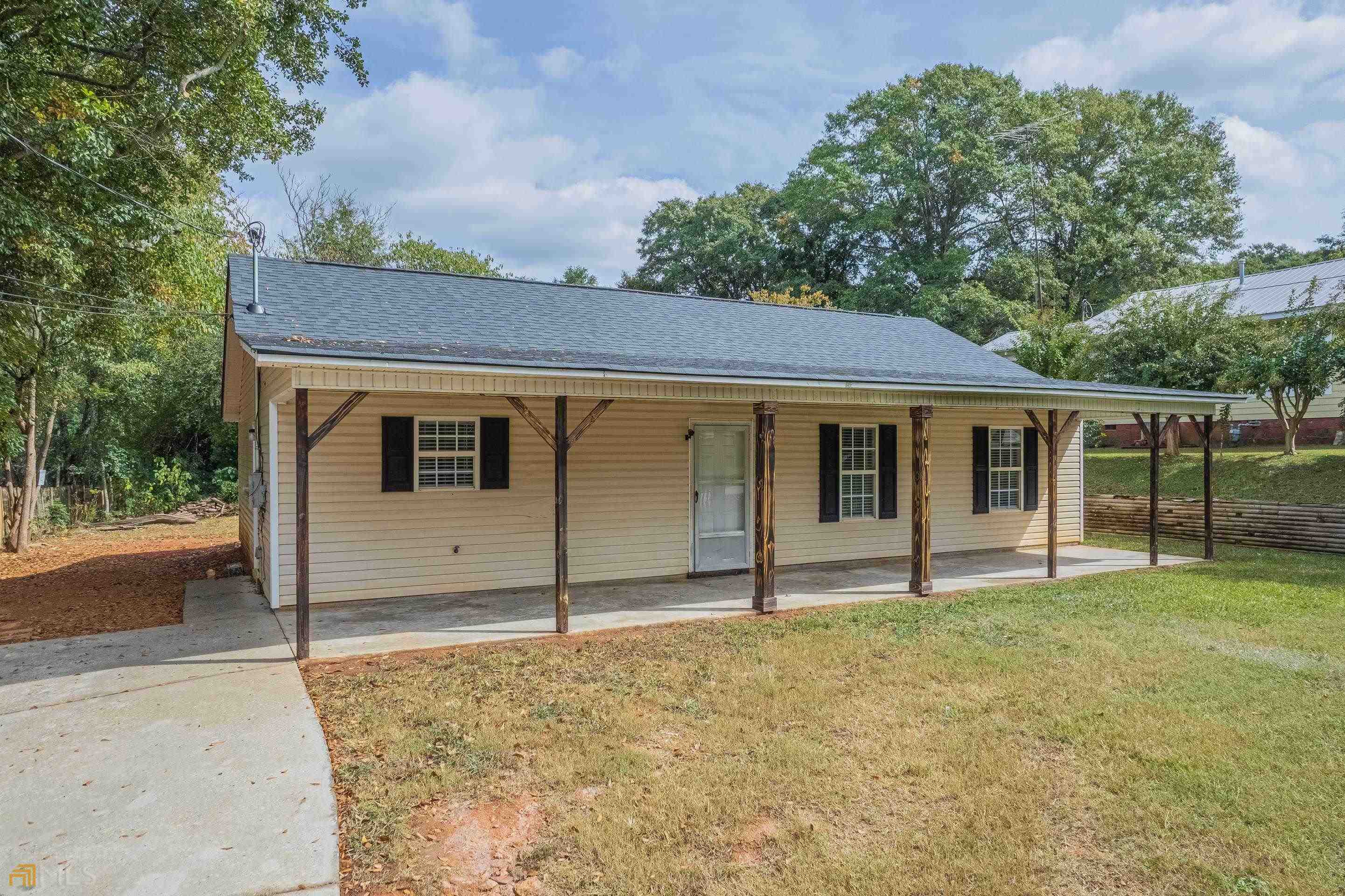 339 Spring Street Commerce, GA 30529 - Photo 1 of 1 front view of a house with a yard