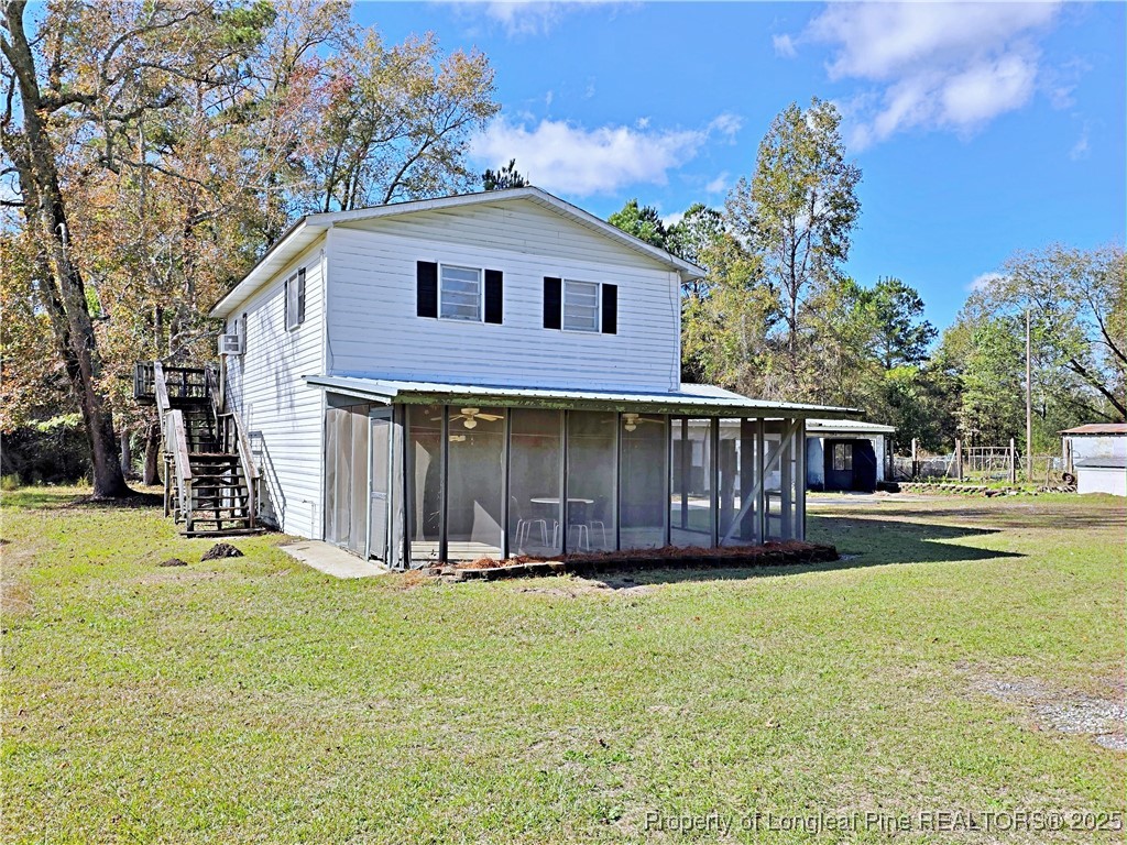 764 Old Vander Road Fayetteville, NC 28312 - Photo 30 of 50 a front view of a house with a yard and garage