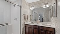 1054 Atterberg Road South Elgin, IL 60177 - Photo 9 of 16 a bathroom with a double vanity sink and a mirror