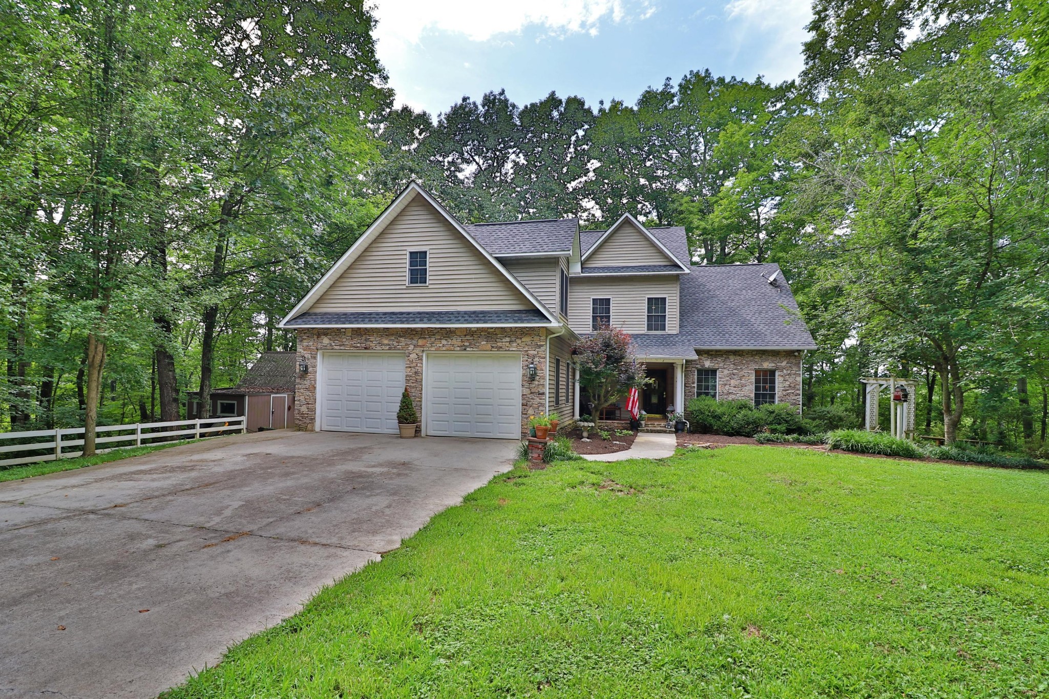 281 Lone Ridge Lane Clinton, TN 37716 - Photo 1 of 40 a front view of a house with a yard and trees
