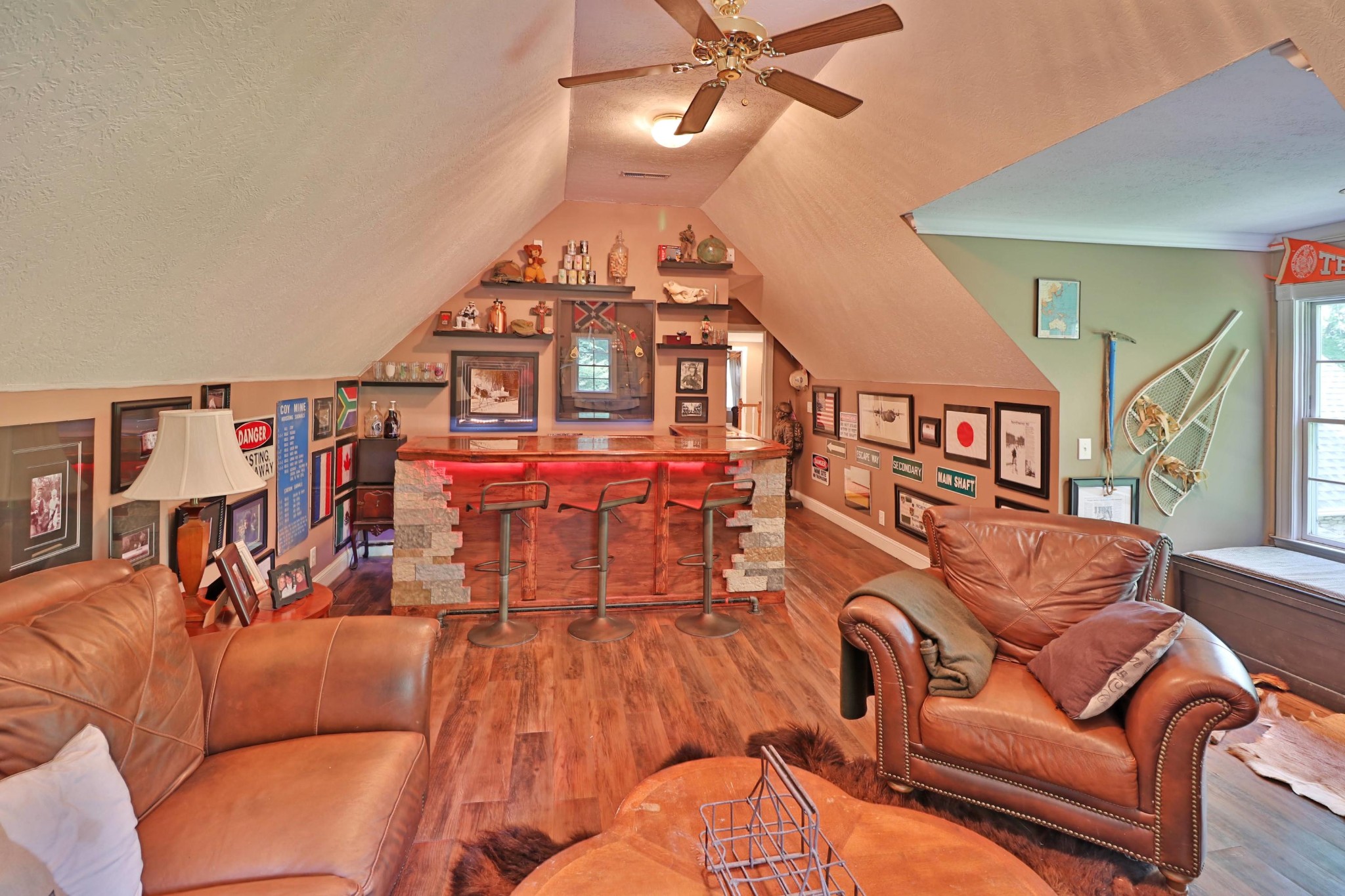 281 Lone Ridge Lane Clinton, TN 37716 - Photo 27 of 40 a living room with furniture a ceiling fan a rug and a window