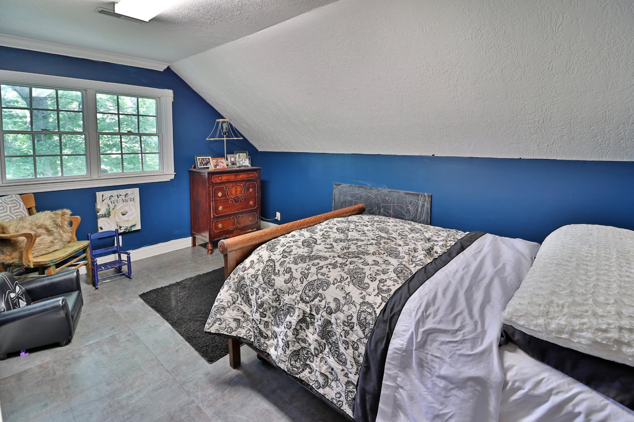 281 Lone Ridge Lane Clinton, TN 37716 - Photo 29 of 40 a bedroom with a bed and wooden floor