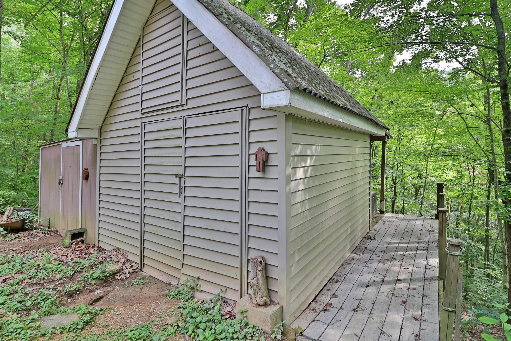 281 Lone Ridge Lane Clinton, TN 37716 - Photo 36 of 40 a view of a small house with a yard