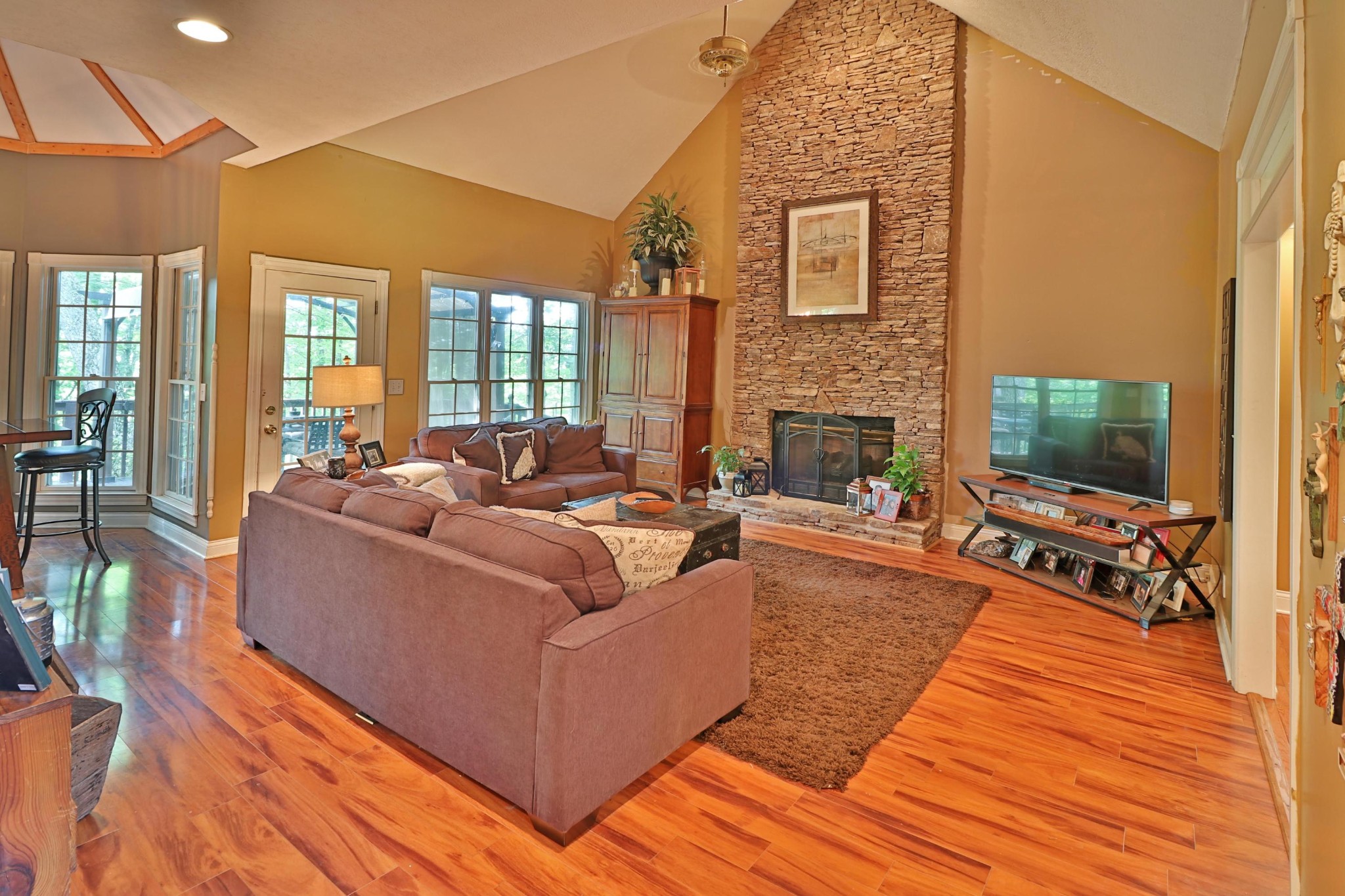 281 Lone Ridge Lane Clinton, TN 37716 - Photo 4 of 40 a living room with furniture a flat screen tv and a fireplace