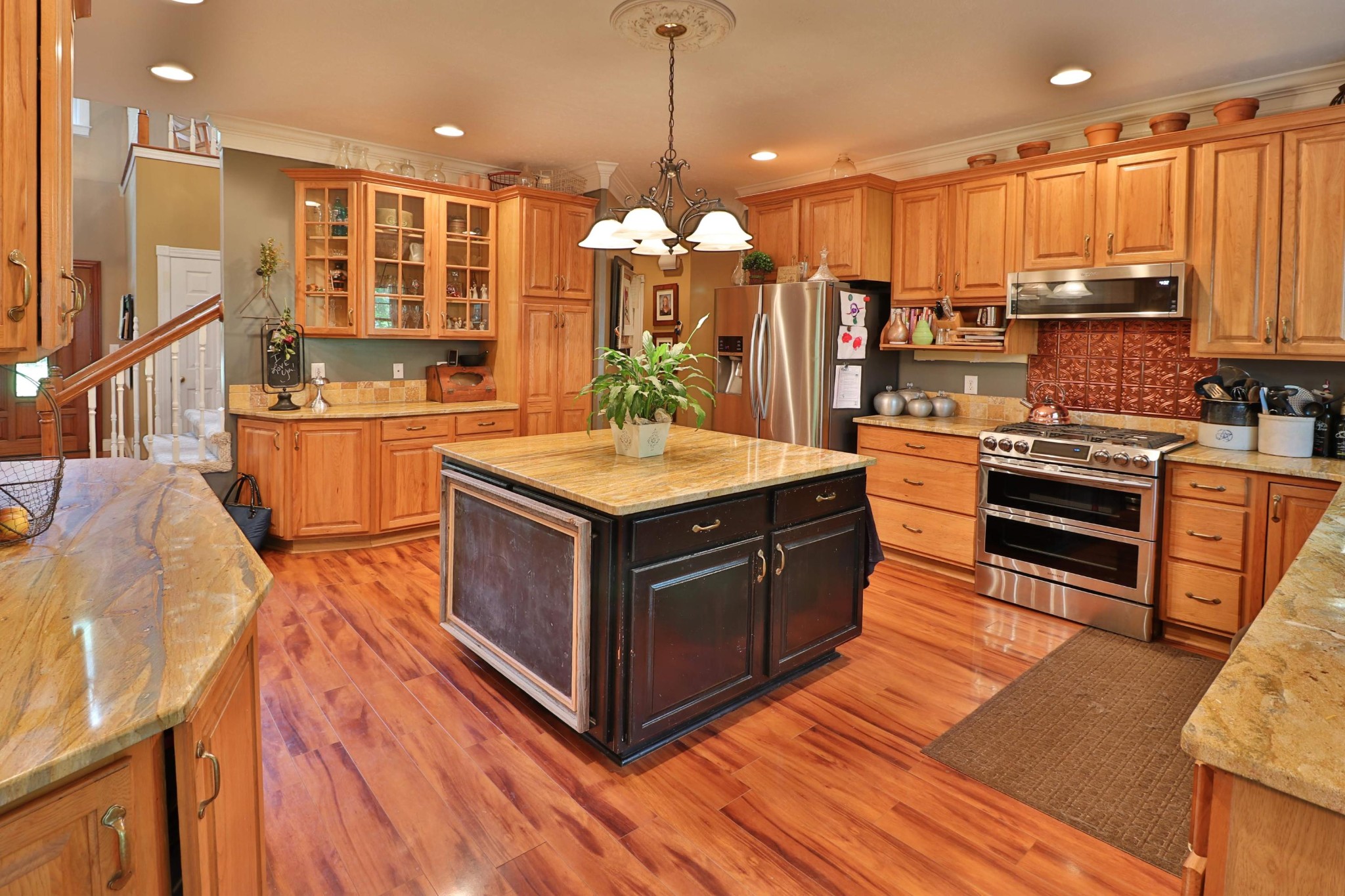 281 Lone Ridge Lane Clinton, TN 37716 - Photo 7 of 40 a kitchen with stainless steel appliances granite countertop a stove a sink dishwasher and a refrigerator with wooden floor
